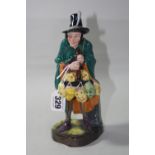 A ROYAL DOULTON FIGURE, 'The Mask Seller' HN2103