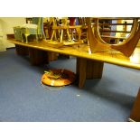 A LARGE BOARDROOM TABLE, made from bubinga wood, with three pedestal supports (splits into three