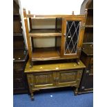 AN OLD CHARM LINENFOLD TWO DOOR CABINET, and a similar trolley with a single door (2)