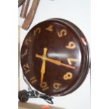 A SMITHS ELECTRIC BAKELITE WALL CLOCK