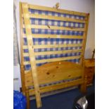 A 4'6' PINE BED FRAME, with mattress