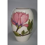 A MOORCROFT POTTERY VASE, 'Magnolia' pattern, impressed backstamp and painted signature, height