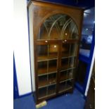 A GLAZED TWO DOOR DISPLAY CABINET, (s.d.)