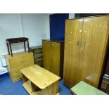 A TEAK TWO DOOR WARDROBE, similar gentleman's wardrobe, chest of four drawers, tallboy and a