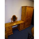 A PINE TWO DOOR WARDROBE, above two drawers, dressing table with six drawers and a seperate swing