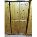 A PINE TWO DOOR WARDROBE, approximate size width 86cm x height 180cm x depth 52cm