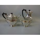 A FOUR PIECE SILVER TEA SERVICE, shaped oval form with angled rims and bases, teapot and hot water