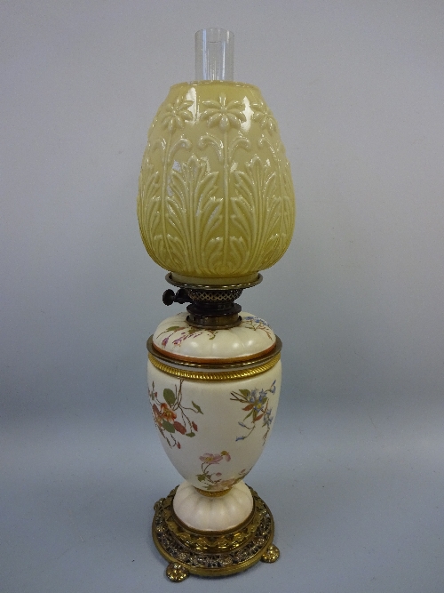 A ROYAL WORCESTER OIL LAMP, the baluster body decorated with floral sprays, Hinks & Sons burner,