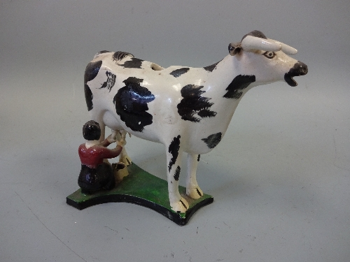 A 19TH CENTURY YORKSHIRE ? PEARLWARE COW CREAMER, decorated in black and white enamels with