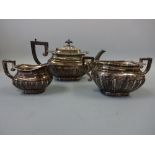 A MATCHED SILVER THREE PIECE TEA SERVICE, half reeded with moulded border, teapot with ebonised