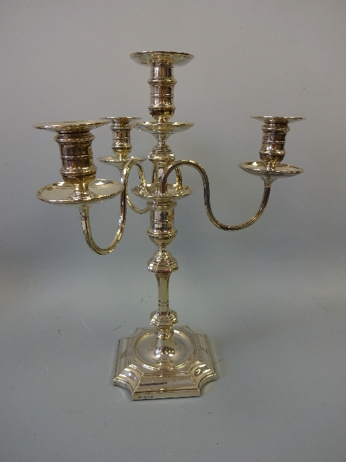 A SILVER PRESENTATION FOUR BRANCH CANDELABRA, with central urn candlestick supporting three 'S'