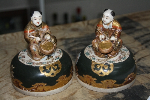 A PAIR OF ORIENTAL VASES AND COVERS, of baluster form with gilt relief highlighted figural - Image 4 of 4