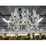 A GLASS TWO TIER NINE BRANCH CHANDELIER WITH DROPPERS (sd)