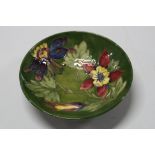 A MOORCROFT POTTERY FOOTED BOWL, Columbine pattern, impressed factory mark and painted signature,