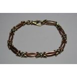 A FANCY CHAIN LINE BRACELET, with rose, yellow and white metal links, length 20cm, weight