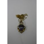 A 9CT GOLD PENDANT NECKLACE, with oval central mystic topaz within a decorative surround, length