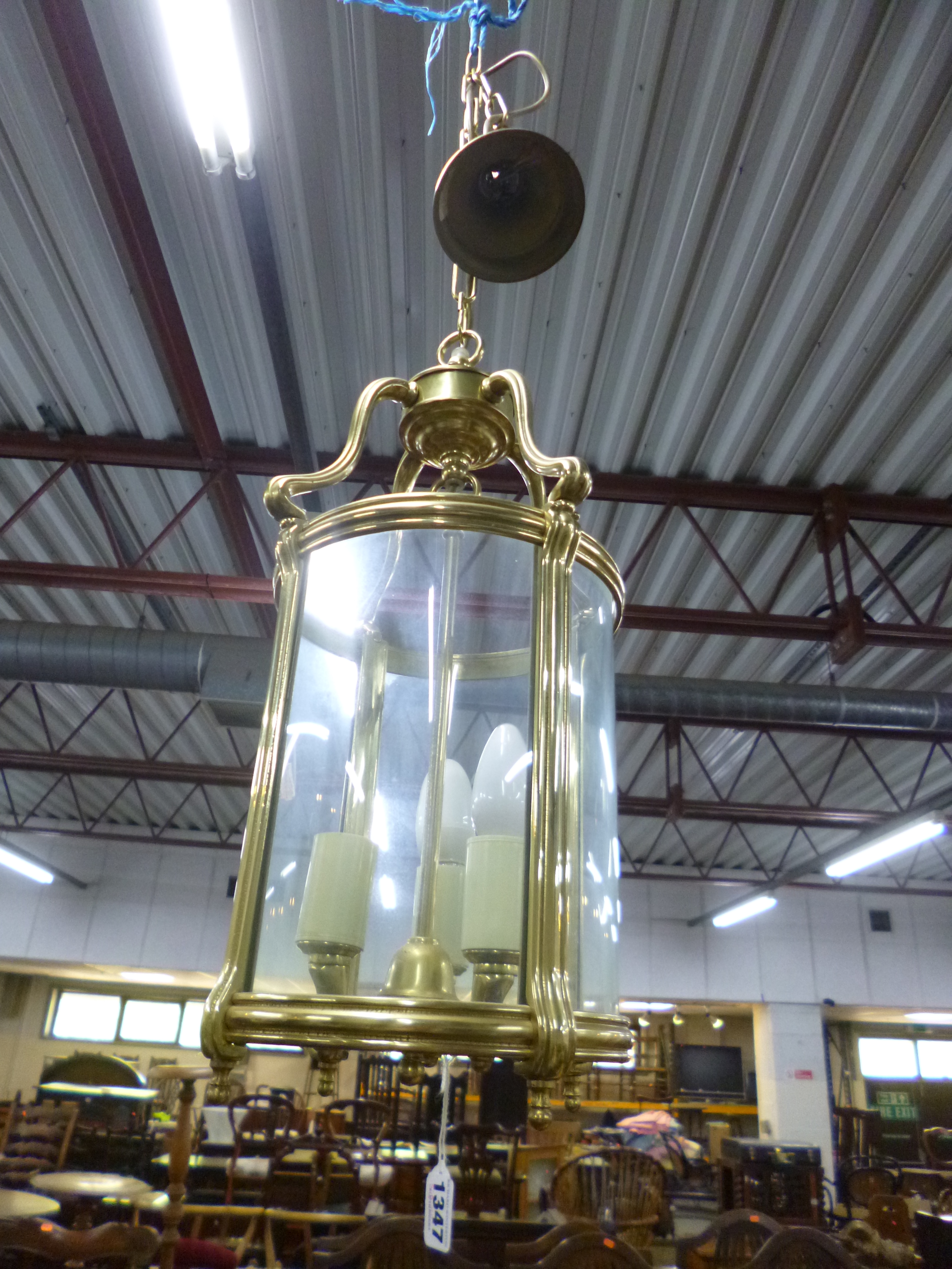 A MODERN BRASS CIRCULAR THREE BRANCH CEILING LANTERN