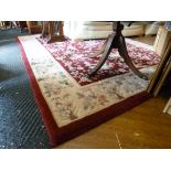 A LARGE FLORAL CARPET SQUARE, approximate size 298cm x 238cm and a modern chest of bedside