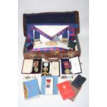 A SMALL LEATHER CASE, containing archive of Freemason Memorablia, namely six medallions, silver