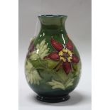 A MOORCROFT POTTERY BALUSTER VASE, Columbine pattern, impressed factory mark and painted