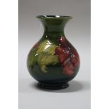 A MOORCROFT POTTERY VASE, Hibiscus pattern, impressed marks, height approximately 13.5cm