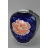 A BOXED JAPANESE FUKAGAWA PORCELAIN VASE, of ovoid from with coral floral decoration to blue