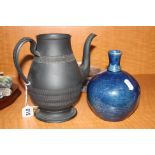 A BLACK BASALT COFFEE POT, (lid in pieces), together with a stoneware vase, blue glaze, height