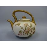 A ROYAL WORCESTER IVORY PORCELAIN TEAPOT AND COVER, with floral spray decoration, gilt up and over