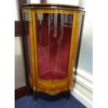 A LOUIS XVI STYLE SERPENTINE KINGWOOD CORNER VITRINE, with glazed bow front door to velvet lined