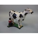 A 19TH CENTURY YORKSHIRE ? PEARLWARE COW CREAMER, decorated in black and white enamels with