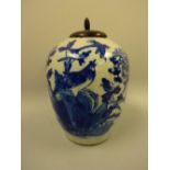 AN ORIENTAL OVOID FORM VASE, decorated in blue enamels with birds, insects and flowers, with