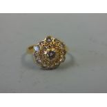 A DIAMOND CLUSTER RING, comprising of old-cut diamonds within a floral shape to a plain tapered