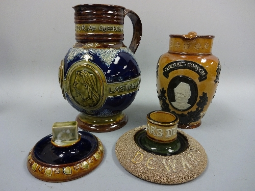 ROYAL DOULTON LAMBETH COMMEMORATIVE JUGS, General Gordon, approximately 19cm high, and Queen