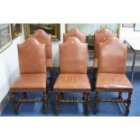 A SET OF SIX OAK FRAMED DINING CHAIRS, with tan leather upholstered seats and backs