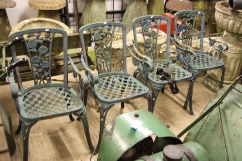 A SET OF FOUR PAINTED CAST IRON GARDEN ARMCHAIRS, with floral detail