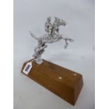 A CHROME CAR MASCOT, of a jumping horse and jockey on a wooden plinth