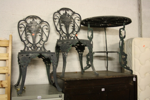 A PAINTED ALUMINIUM CIRCULAR GARDEN TABLE, and two chairs (3)