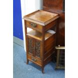 AN OAK FLOOR STANDING SMOKERS CABINET, with gallery top, two drawers and central cupboard