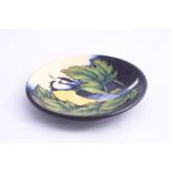 A MOORCROFT POTTERY TRINKET DISH, Inglewood pattern with Blue Tit and Leaves, impressed and