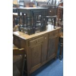 A SMALL OAK SIDEBOARD, with two drawers and cupboards and an oak nest of tables (2)