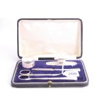 A BOXED SILVER MANICURE SET, hallmarks for Birmingham