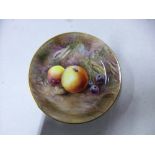 A ROYAL WORCESTER TRINKET DISH, Fallen Fruits design by D. Bowket, black factory mark, diameter