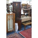 A WALNUT SINGLE DOOR DISPLAY CABINET, a mahogany glazed corner cupboard and a teak tile top coffee