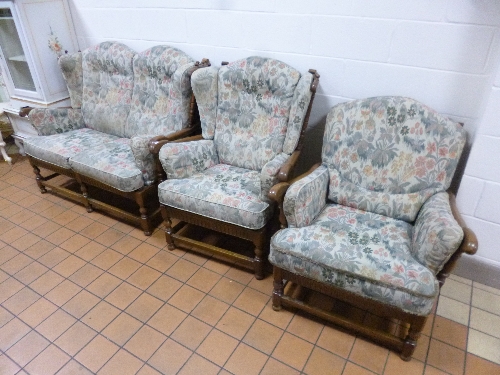 AN ERCOL THREE PIECE LOUNGE SUITE, with removable upholstered cushions, comprising of a two seater