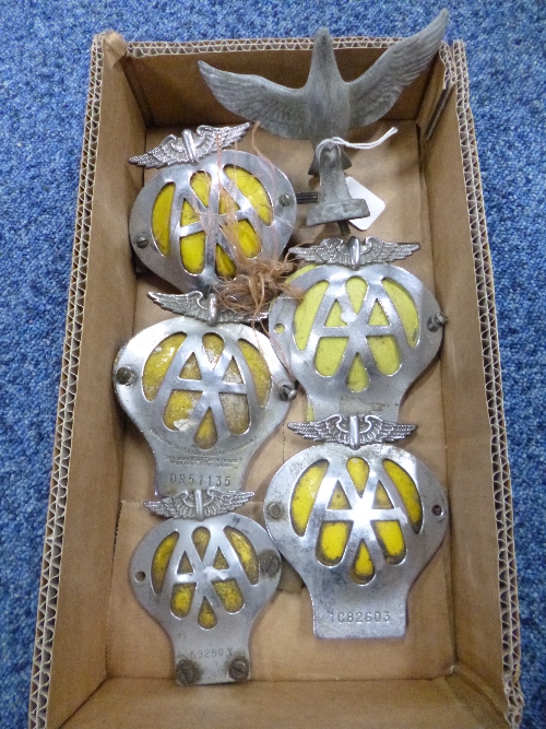 FIVE AA MEMBERSHIP BADGES, with a fixed yellow backing and a car mascot in the form of a Dove (6)