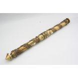 A BRASS SCROLL HOLDER, with applied moulded acorn and oak leaf decoration, twisting end to reveal