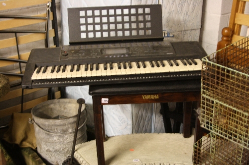 A YAMAHA ELECTRONIC KEYBOARD, with stand and stool