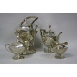 A FOUR PIECE SILVER AMERICAN TEA SERVICE, comprising spirit kettle, burner and stand, teapot, lidded