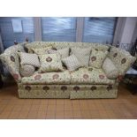 A LARGE KNOLL STYLE BEIGE FLORAL UPHOLSTERED SETTEE, and nine various loose cushions