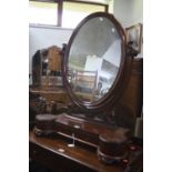 A VICTORIAN OAK SWING MIRROR, with drawer and twin lidded compartments (key)